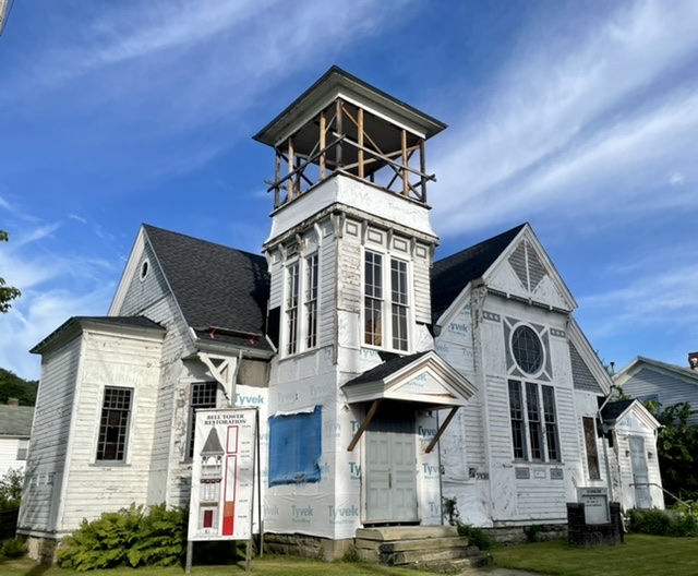 The former Old Lutheran church with a new roof and gutters.  The church tower is under construction 